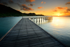 A beautiful image of the sunset off the end of a pier