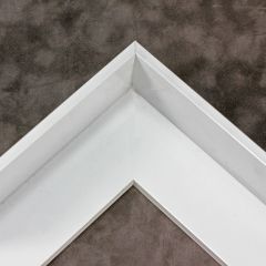 This metal canvas floater picture frame has a smooth, Semi-gloss white finish and flat, narrow (.25 ") face. 

Ideal for medium to large size artwork on thick (1-5/8 " deep) stretcher bars.  Border gallery wrapped Giclée canvas prints or paintings with this simple, modern frame for an authentic, fine art display.

*Note: These sturdy metal, custom canvas floaters are for stretched canvas prints and paintings, and raised wood panels.

Nielsen mf14-14 Profile